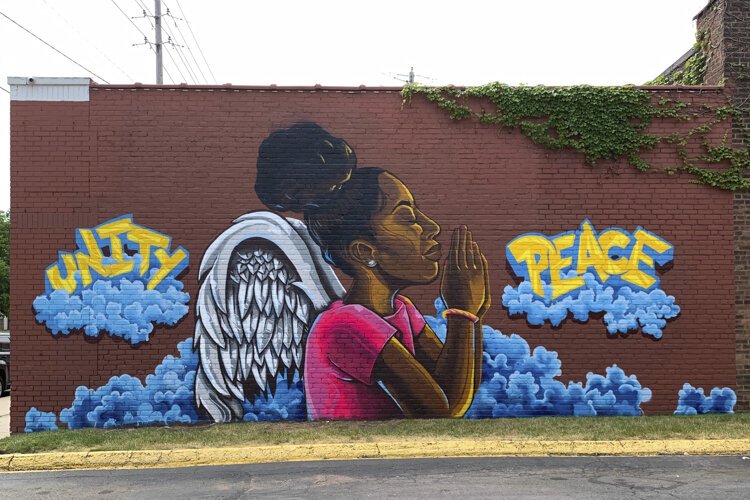 For Juneteenth this year, the artist Kevin “Mr. Soul” Harp installed a mural at Cheers Bar on East 93rd Street near Union Avenue, called “Revolutionary Prayers.”